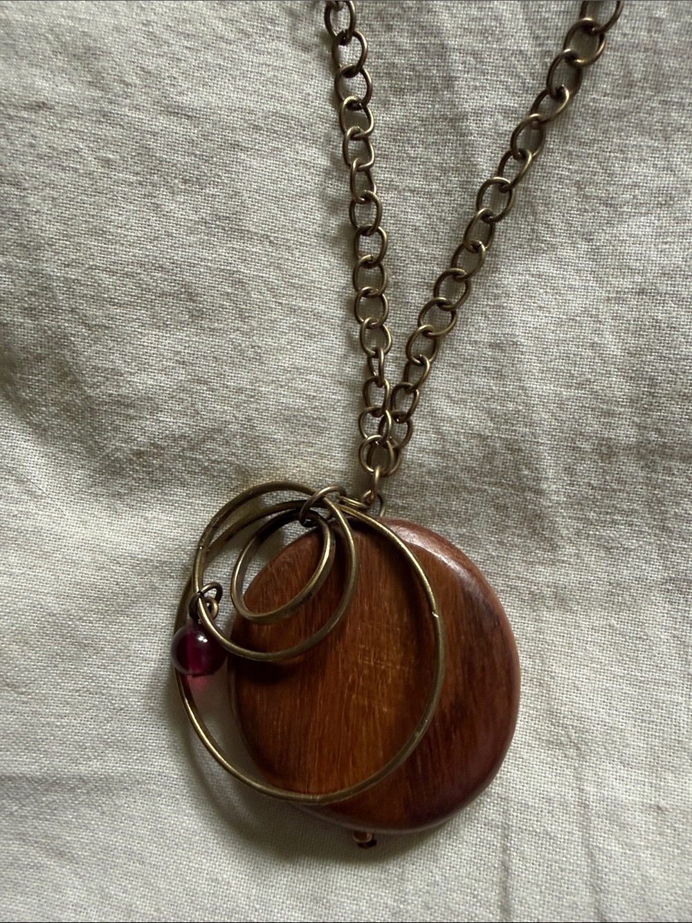 Bronze-Tone Wooden Disc Necklace with Deep Garnet Accent
